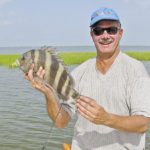 Find the reds, and a few sheepshead are usually around chomping on the same morsels — little crabs.