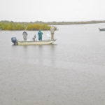 Boats fish the deep hole next to the dock at Basson’s Marina in Galliano.