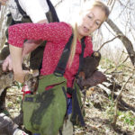 With both hunters holding a hawk, one hand to keep them off the rabbit, it takes two of them to put the bunny in Jenn’s game bag.