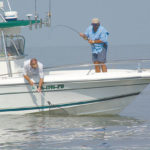 Getting the net is a common sight when fishing offshore around the rigs.
