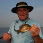 Gary Hayes shows off a typical Lake Cataouatche bluegill.