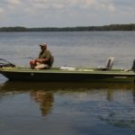 Looney works a bream bed on the shores of Lake Verret from his classic bass boat.