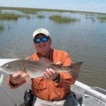 The author with a Raccourci red caught on a topwater.