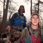 Chance Havard (back) uses a mud boat with a surface drive motor to reach shallow areas where other hunters might not be able to go.