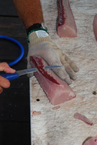 Trim any remaining red flesh off the loins and discard it.
