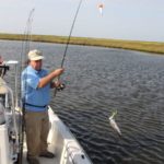 Television personality Gary Respone hauls in a good speckled trout.