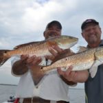 Capts. Bobby Gros and C.T. Williams have caught plenty of reds over their careers, but they couldn’t hide their smiles after taking this double.