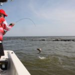 Jeanminette, who fishes almost exclusively dead shrimp, lands a good redfish.