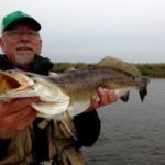 Dan Hassebrook displays his super speckled trout at 9.1 pounds and 30 inches in length taken on Calcasieu Lake when wade-fishing with Capt. Bruce Baugh.