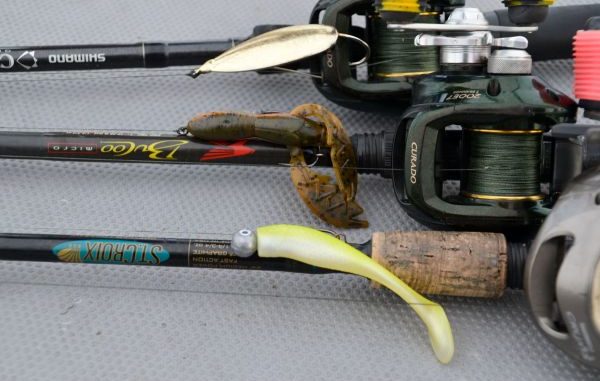 The three lures Stevie Nick uses exclusively are (top to bottom) a 1/2-ounce gold Johnson Sprite spoon, an Alabama craw-colored NetBait Baby Paca Craw on a 1/4-ounce Rockport Rattler jighead and a lemonhead-colored Matrix Shad on a 1/4-ounce Goldeneye jighead.