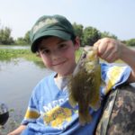 When the bream are biting there’s no better time to take a kid fishing. Here the author’s grandson holds a good google-eye caught in the lower Atchafalaya Basin.