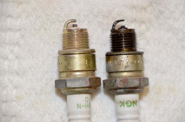 Extended use of boat spark plugs, such as the one on the right, erodes the metal and increases the gap in the plug reducing its performance.