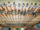 Hanging rods from the ceiling of your storage shed keeps them out of the way and prevents damage.