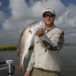 Capt. Cody Obiol, of Cajun Fishing Adventures, shows off a nice Buras redfish.