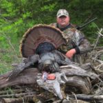 Peyton McKinnie took this beautiful gobbler along the river. HIs good luck charm, the “Little Scratch” call is shown beside the trophy.