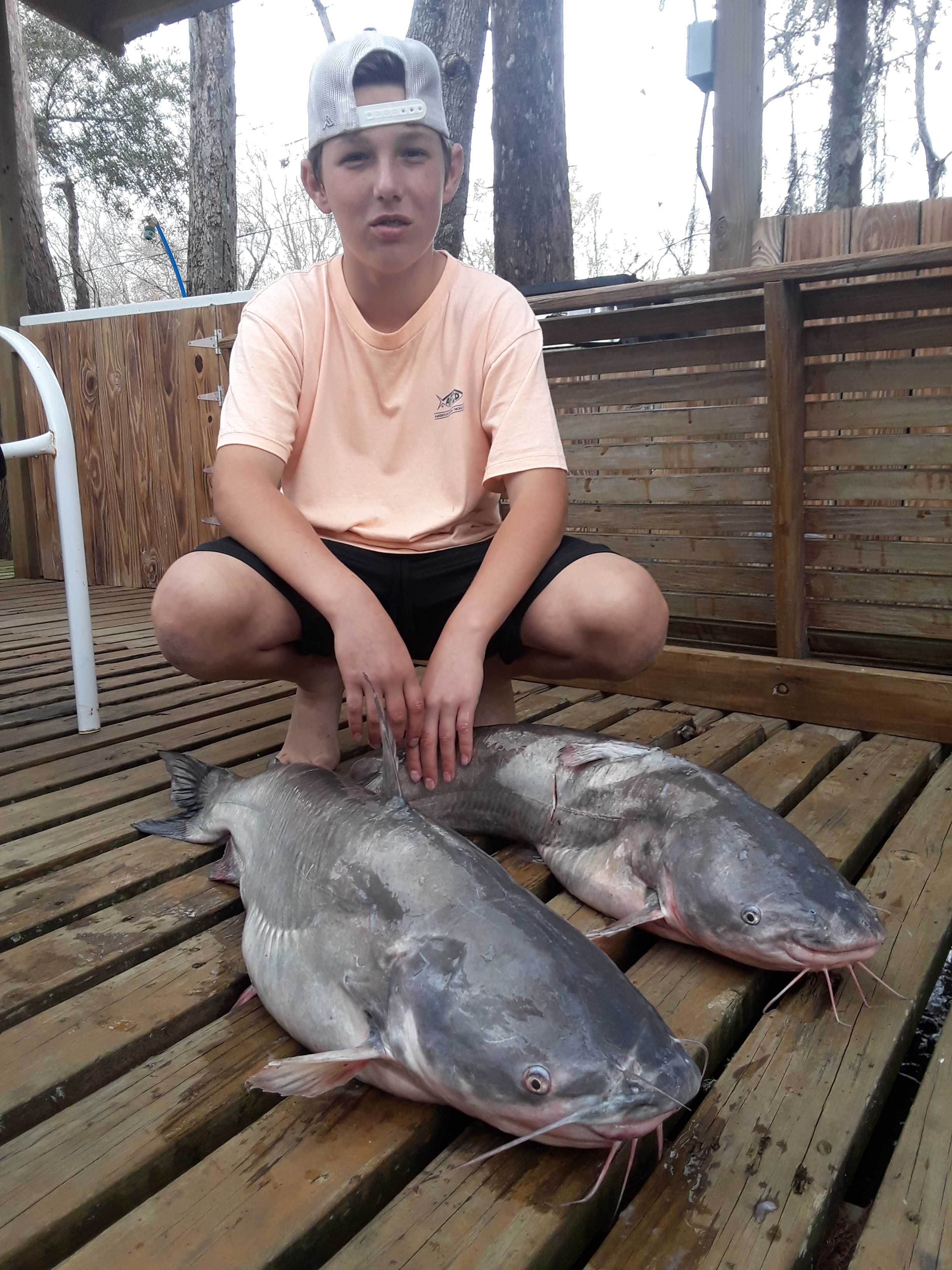 Carson Landry, 14, with catfish caught fishing jug lines baited with live crawfish in Belle River.