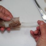 4) Pull the transparent, semi-rigid pen from the tube and discard it.
