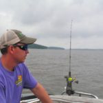 David White watches the flags on several planer boards following his boat. When the flag does down, a crappie usually comes up.