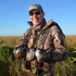 Green-winged teal, like these held by Ray Bellant, can usually be depended upon to fill out a bag limit.