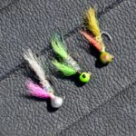 Murphy Royer’s favorite jig colors (all tied by him) are, from top: olive, chartreuse head-rainbow body-chartreuse fin-chartreuse tail, and rainbow head-rainbow body-pink fin-gray tail. The rainbow head is produced by painting it with fingernail polish.