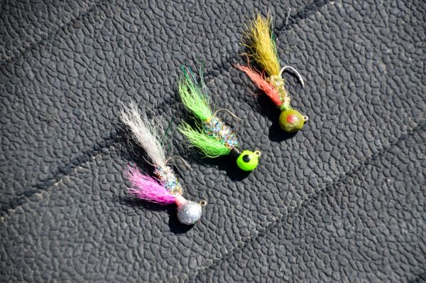 Murphy Royer’s favorite jig colors (all tied by him) are, from top: olive, chartreuse head-rainbow body-chartreuse fin-chartreuse tail, and rainbow head-rainbow body-pink fin-gray tail. The rainbow head is produced by painting it with fingernail polish.