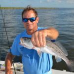 Queen Bess Island, visible behind Auenson, is completely armored with rock rip-rap that is very hard on monofilament lines.