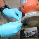2- Use a bench grinder to grind one end of the cork into a flat-tipped cone.