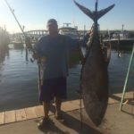 Kyle Boyd poses with the 239.5-pound yellowfin tuna he reeled in on Friday during the 2016 Creole Classic. If certified, it will be the new No. 3-ranked yellowfin tuna in the state.