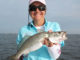 Nancy Comeaux shows off the type of Grand Isle specks anglers flock to the island for in June.