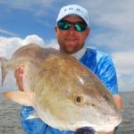 Capt. Cody Obiol with Cajun Fishing Adventures shows off a big bull caught with a LiveTarget black tiger rigged shrimp near Baptiste Collette Pass east of the Mississippi River near Venice.