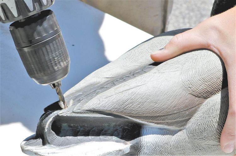 Plastic decoys with shot holes and cracks often fill with water but don’t drain easily. Drill a hole on top of the decoy to drain it quickly, and then use silicone to seal the holes and cracks.