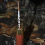 2) Take a drill, select the proper-sized bit, and drill out the spent primer. You can pop one out more easily with a shotgun reloading vice.