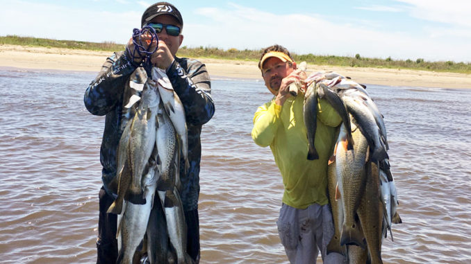 Sammy Romano, left, and Cabot Corso enjoyed an epic day in the surf at Elmer’s Island last April, catching limits of specks using suspended jerkbaits.