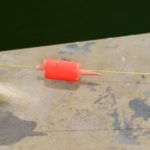 Tregle chops down the toothpick corks he uses until they barely float the jig.