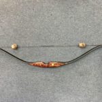 A recurve bow displays the nostalgic appearance of a traditional bow.