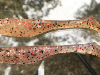 After being devoured by speckled trout and redfish, clear-plastic baits like the shrimp creole-colored Matrix Shad on top, can change colors. A fresh new clear bait is shown below. (Photo by Todd Masson)