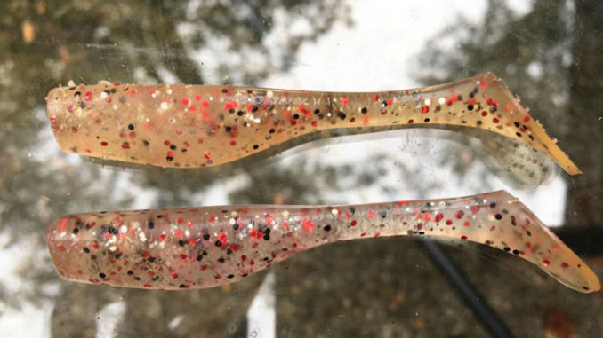 After being devoured by speckled trout and redfish, clear-plastic baits like the shrimp creole-colored Matrix Shad on top, can change colors. A fresh new clear bait is shown below. (Photo by Todd Masson)