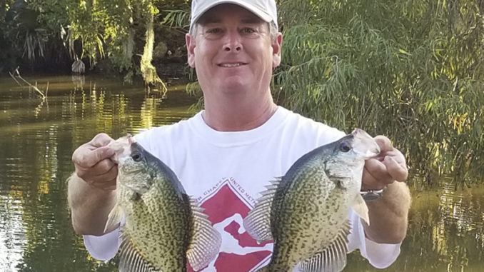 Bill McCarty holds two slabs caught in the Stephensville area.