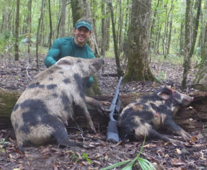 Josh Chauvin killed these two spotted hogs with a single-shot Midland Backpack 12-gauge, which weighs less than 5 pounds. 