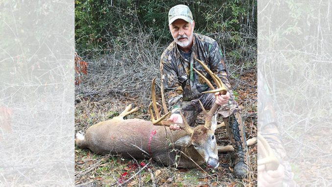 Larry Bringol, of Youngsville, poses with the big Natchitoches Parish 10-pointer he shot on Nov. 18 near Provencal. The buck green-scored about 173 inches of bone.
