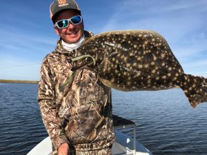 In addition to his 6-pound speck, Chas Champagne also reeled in a nice flounder Wednesday morning in Lakeshore Estates. 