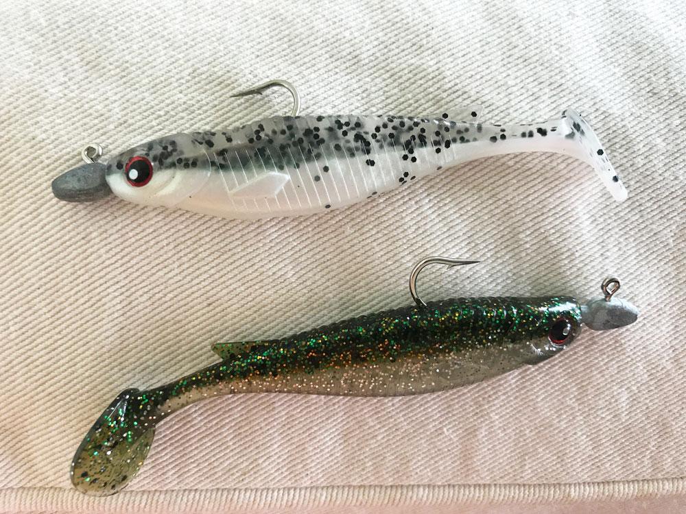 Vidrine’s go-to swimbaits this winter are Overcast Lures’ Swim Shad in salt and peppa (top) and marsh bass. Vidrine rigs them on 1/8-ounce jigheads for a slow fall.