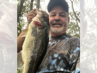 Mike “Pickle” Fontenot of Ville Platte holds one of the hawgs he has caught fishing Chicot Lake.