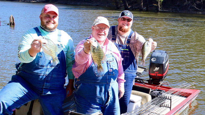 The Maxwells in official fishing clothing along with “Team Overalls” boat logo and all.
