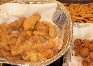 Fried crappie, french fries and hushpuppies... the real treat of a successful day on the water for Team Overalls.