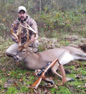 Beau Chenert poses with the big Avoyelles Parish 13-pointer he downed on Jan. 1. The big buck stretched the tape to more than 166 inches of bone. 