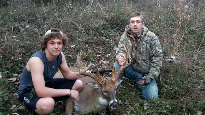 Scotty Smith, right, and his son Hunter take a picture after Scotty dropped this 190-class typical buck in Avoyelles Parish on Jan. 1.