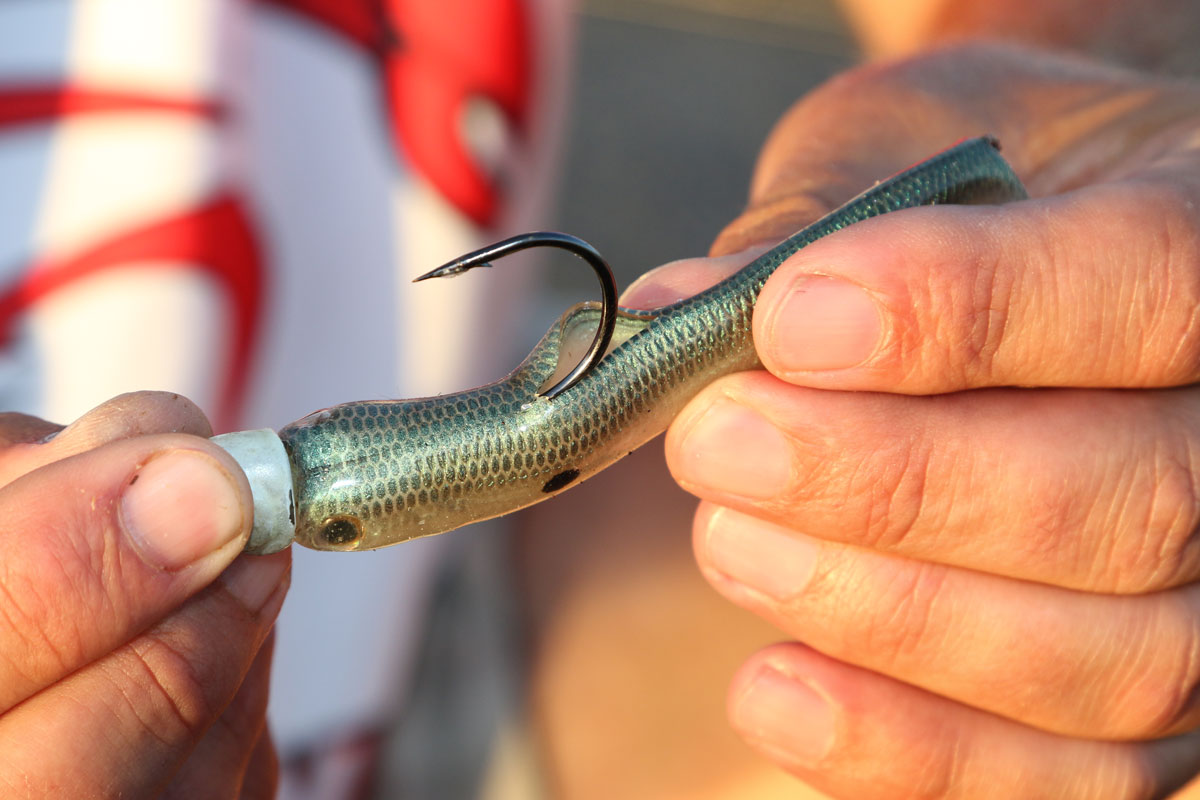 Cutting a slit in the back of a hollow body swimbait allows more hook movement and prevents ripping. 
