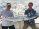 Tyler Hatrel, right, and Keaton Biggs pose with a nice wahoo they reeled in earlier this year while trolling shaky baits south of Fourchon.