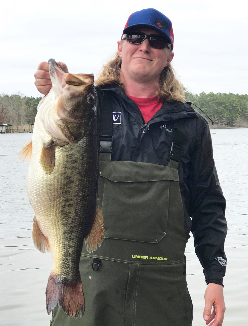 Sean Kennon, 27, of DeQuincy, shows off the monstrous 14-pound lunker largemouth he caught on the south end of Toledo Bend on Saturday, March 2. The big fish, which was tagged and released back into the reservoir, bit a Santone Lures 3/4-ounce football jig in peanut butter and jelly color in about 24 feet of water.